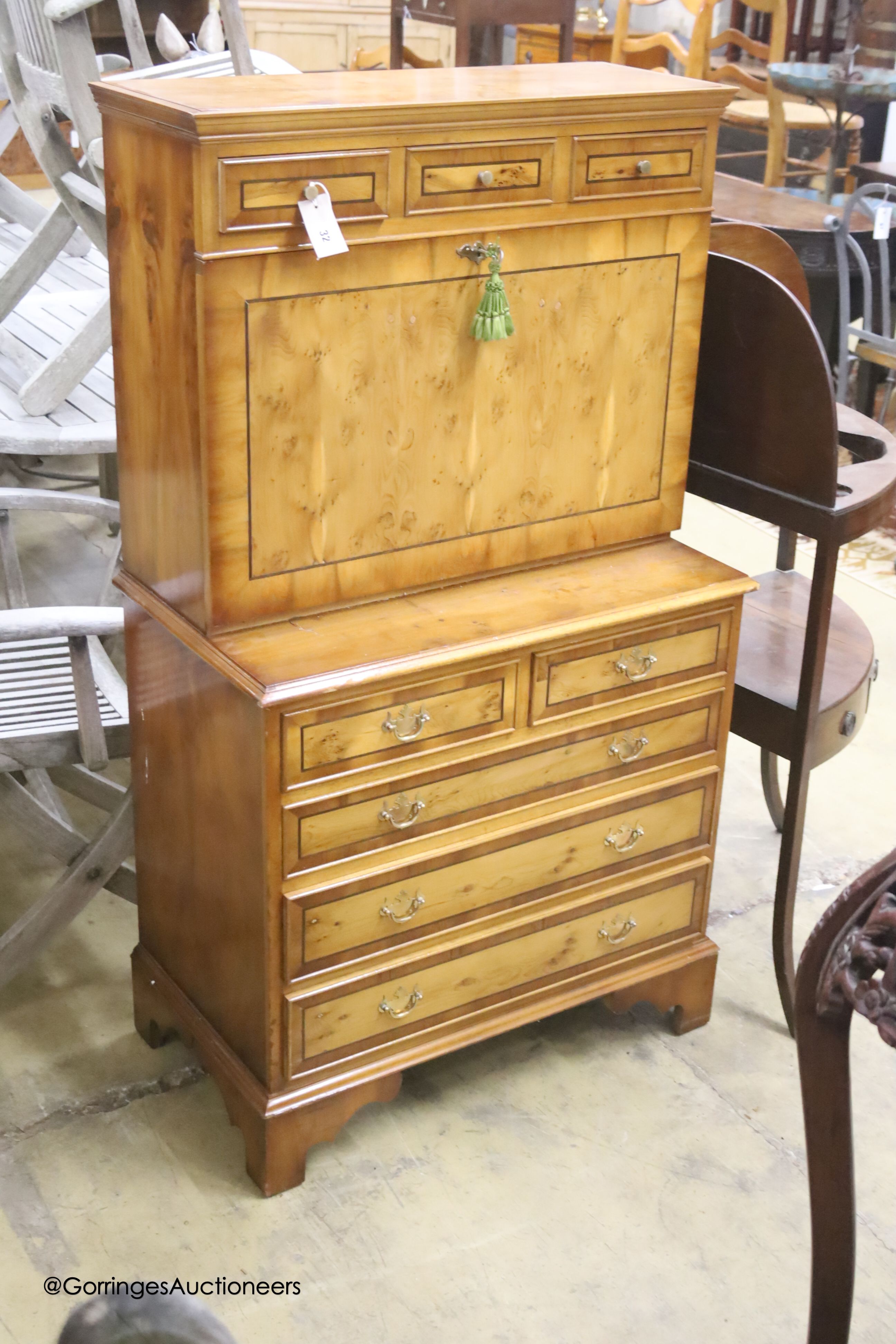 A reproduction yew escritoire, width 74cm, depth 42cm, height 132cm